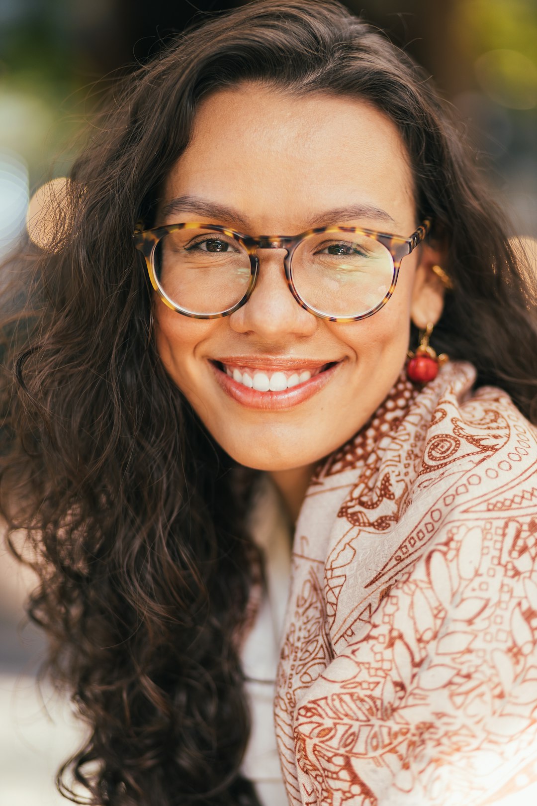 Photo by J. Balla Photography a woman with long hair and glasses